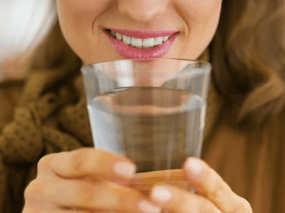 woman with a glass of water